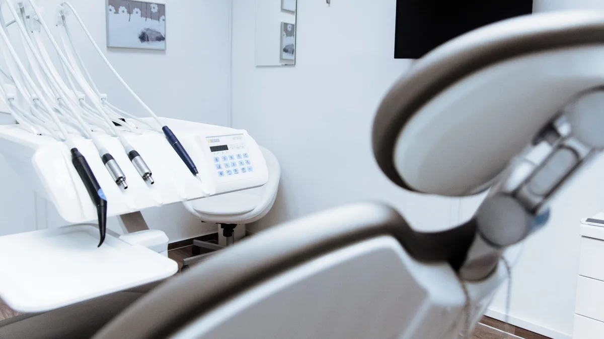 Bright dental office showcasing modern equipment and clean, sleek design.